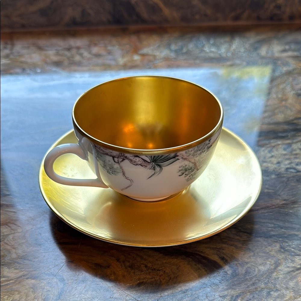 Hermes Gold and White Teacup and Saucer Set